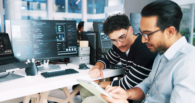 Two professionals in conversation in a bright office lounge